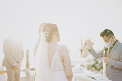 Rear view of couple holding hands