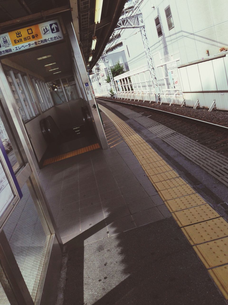 transportation, railroad station, built structure, architecture, railroad station platform, railroad track, public transportation, rail transportation, indoors, city, the way forward, subway station, building exterior, empty, incidental people, travel, city life, high angle view, diminishing perspective, public transport