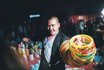 Man performing art at market place