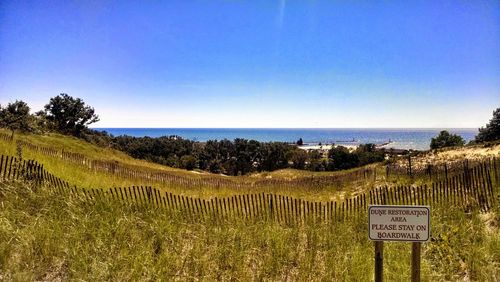 Scenic view of sea against clear blue sky