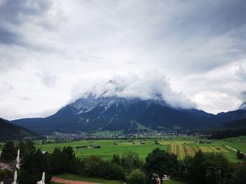 Scenic view of landscape and mountains against sky