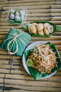 Close-up of food in plate on bamboos