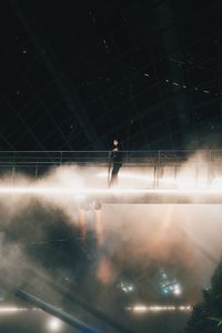 Full length of man on illuminated stage at night