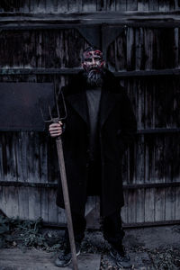 Portrait of person standing in abandoned building