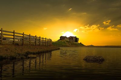 Scenic view of lake against sky during sunset