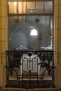 Table and chairs against wall in building