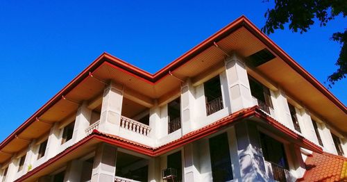 Low angle view of building against clear blue sky