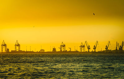 Scenic view of sea against clear sky during sunset