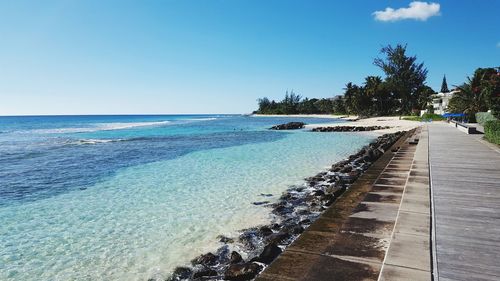 Scenic view of sea against clear blue sky