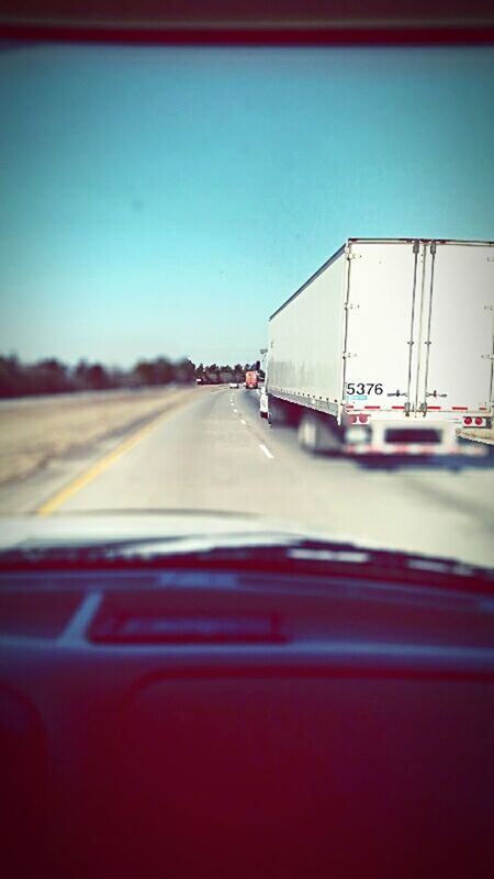 transportation, mode of transport, land vehicle, car, vehicle interior, road, windshield, travel, clear sky, on the move, glass - material, transparent, car interior, diminishing perspective, car point of view, road marking, journey, highway, sky, motion