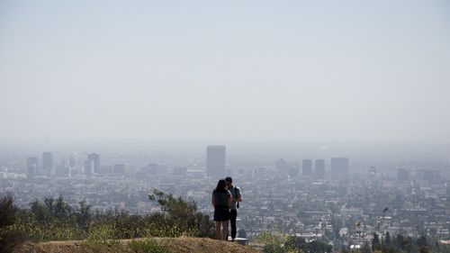 View of a couple against cityscape