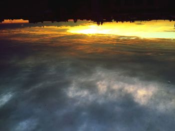 Scenic view of landscape against sky at sunset