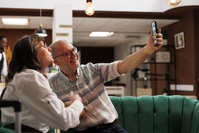 Side view of woman using mobile phone