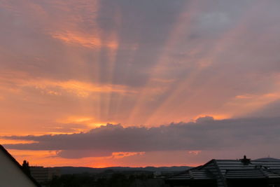 Low angle view of buildings against sky during sunset