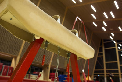 Low angle view of illuminated lights hanging on ceiling in building