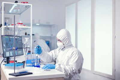 Scientist examining chemical in laboratory