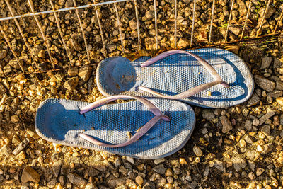 High angle view of shoes on beach