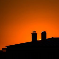 Low angle view of building at sunset