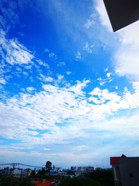 Low angle view of buildings against blue sky