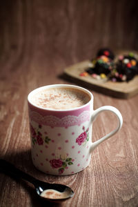 Close-up of coffee cup on table