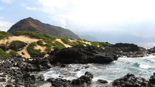 Scenic view of sea against cloudy sky