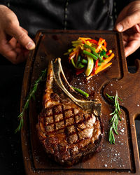 Close-up of man preparing food