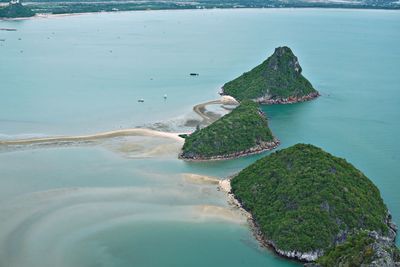 High angle view of rocks on sea shore