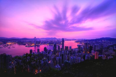 Panoramic view of city lit up at night