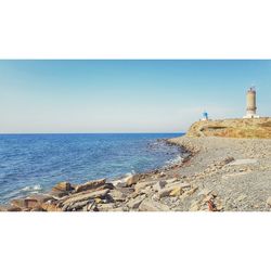 Scenic view of sea against clear blue sky