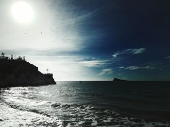 Scenic view of sea against cloudy sky