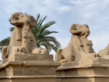 Low angle view of statue against sky