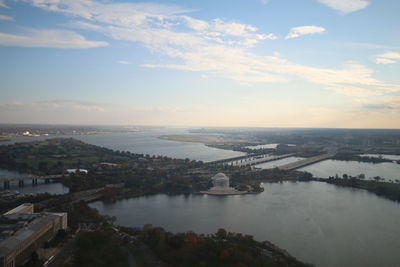 High angle view of bay and bridge against sky