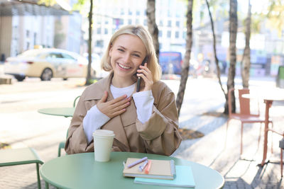 Young woman using phone