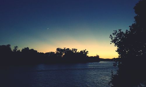 Scenic view of calm sea at sunset