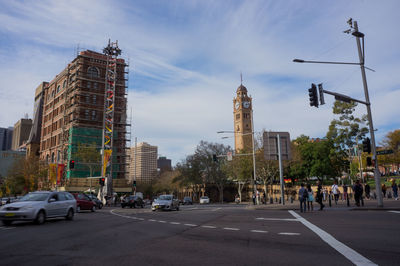 City street and buildings against sky