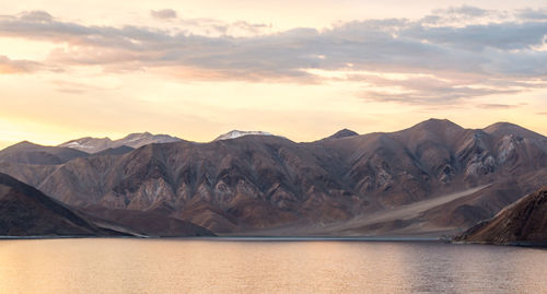 Scenic view of mountains against sky during sunset