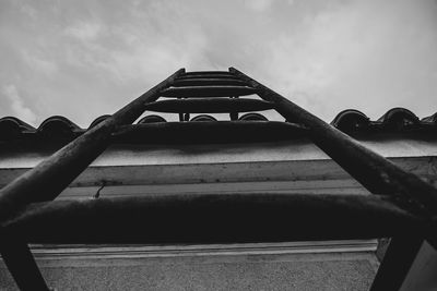 Low angle view of building against cloudy sky