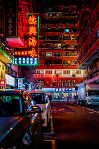 Cars on street in city at night