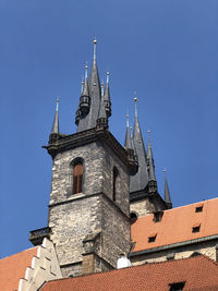 Low angle view of church of our lady before tyn in prague under clear blue sky