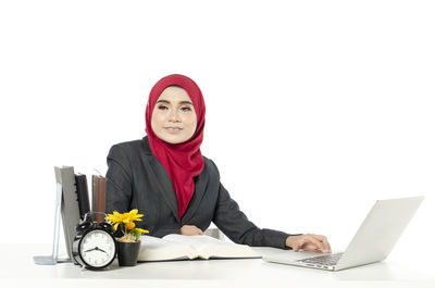 Portrait of a young woman using mobile phone