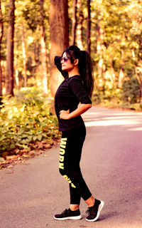 Full length of young woman standing on land