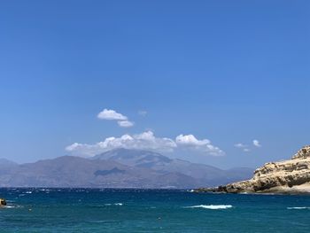 Scenic view of sea against blue sky