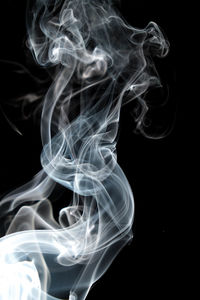 Close-up of smoke against black background