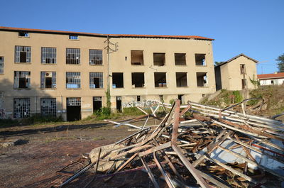 Exterior of abandoned building against clear sky