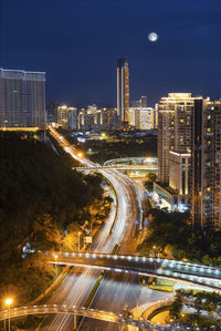 High angle view of light trails on city street at night