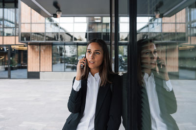 Young businesswoman talking on mobile phone