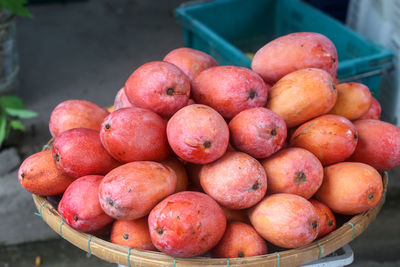 Fruits such as red mango are sold at dam market, nha trang city , khanh hoa