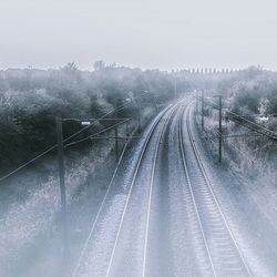 Railroad tracks in foggy weather