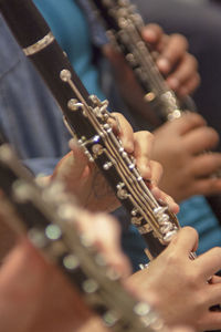 Midsection of people playing guitar