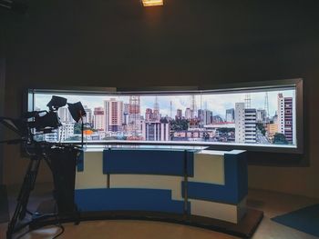 People working on table in illuminated room